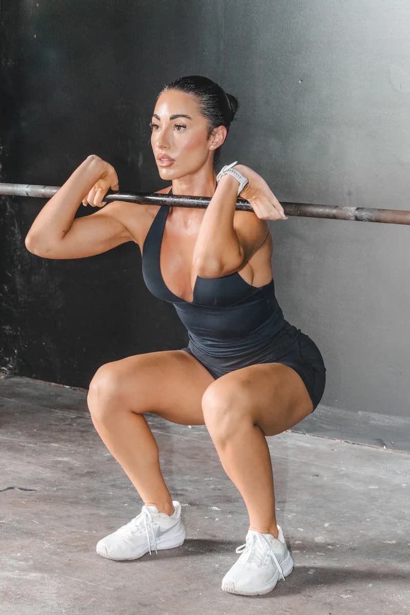Jazmin at the bottom of a barbell front squat